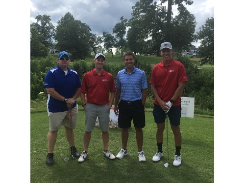 Four golfers on course